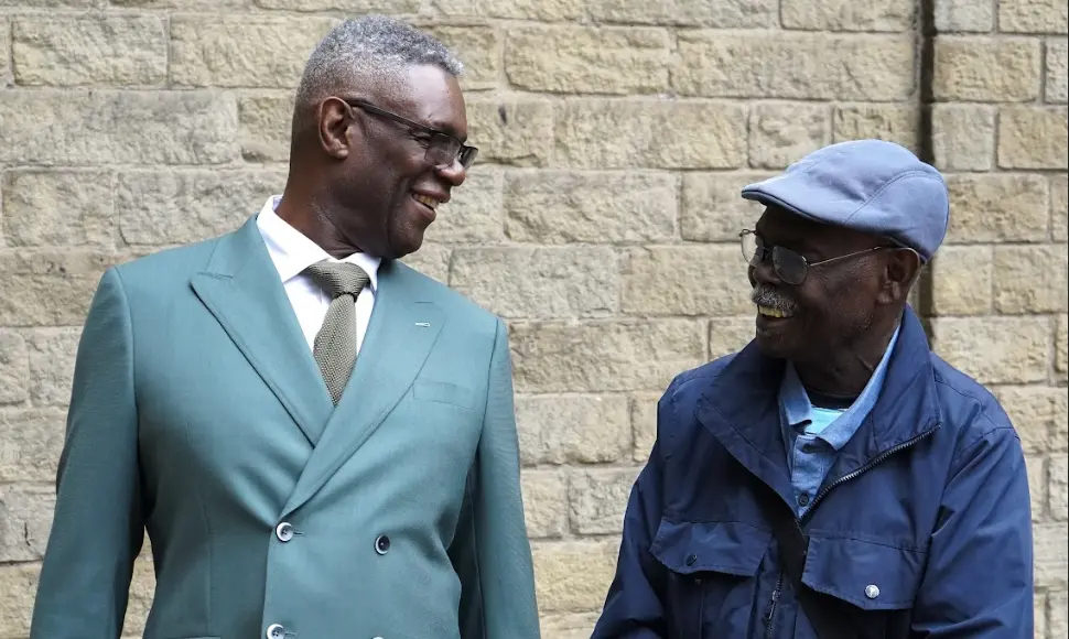 Clients wearing bespoke suits outside DR Bespoke tailoring studio in Halifax